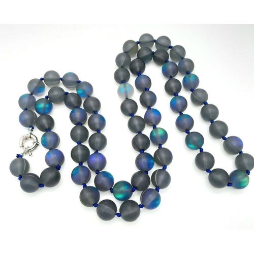 730 - An Electrifying Dark Grey Moonstone Matinee Length Necklace. 90cm in length with excellent colour-pl... 