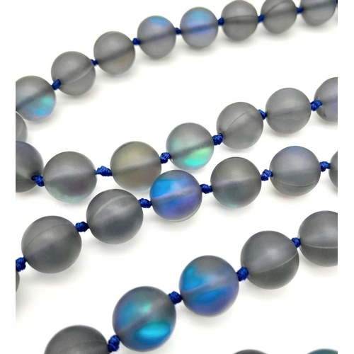 730 - An Electrifying Dark Grey Moonstone Matinee Length Necklace. 90cm in length with excellent colour-pl... 