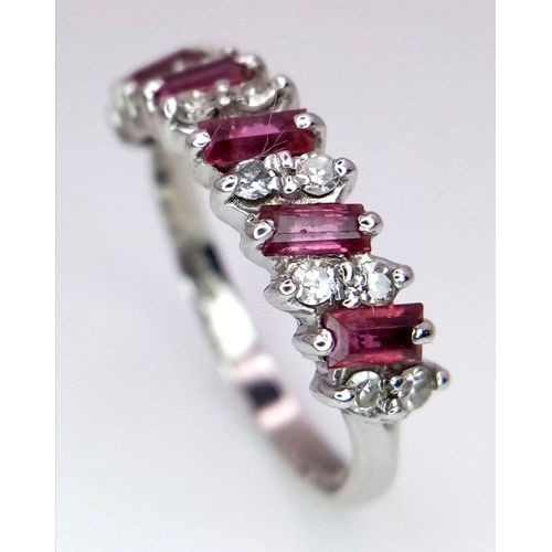 102 - AN 18K WHITE GOLD ( TESTED ) DIAMOND & RUBY BAND RING - 3.9G. SIZE Q. REF: 8555