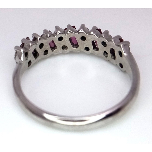 102 - AN 18K WHITE GOLD ( TESTED ) DIAMOND & RUBY BAND RING - 3.9G. SIZE Q. REF: 8555