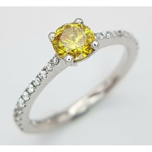 12 - AN 18K WHITE GOLD AND YELLOW DIAMOND 0.42CT RING - WITH DIAMOND SET SHOULDERS. 2.2G. SIZE I. REF: JL... 