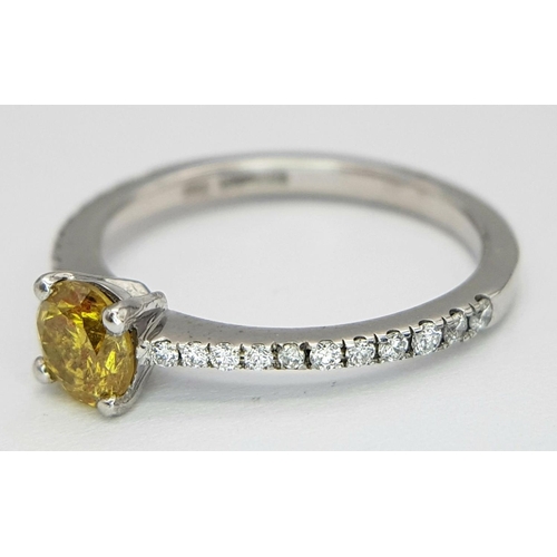 12 - AN 18K WHITE GOLD AND YELLOW DIAMOND 0.42CT RING - WITH DIAMOND SET SHOULDERS. 2.2G. SIZE I. REF: JL... 