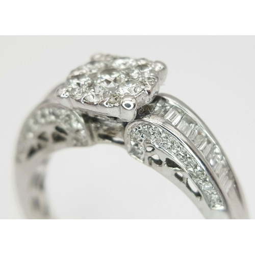 341 - AN 18K WHITE GOLD DIAMOND RING - 0.64CTW.  3.9G. SIZE N. REF: 7668