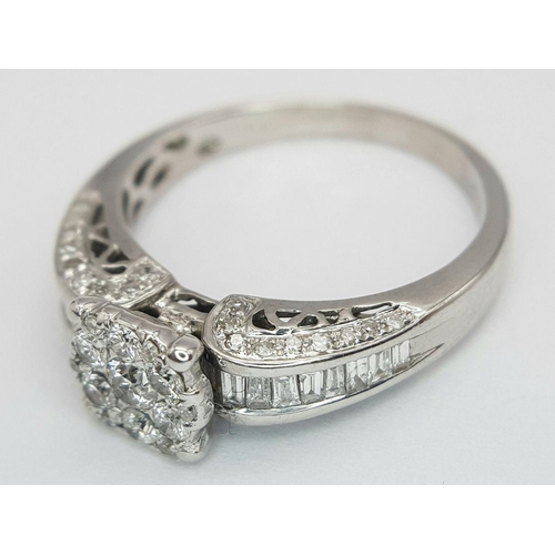 341 - AN 18K WHITE GOLD DIAMOND RING - 0.64CTW.  3.9G. SIZE N. REF: 7668