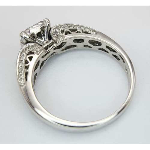 341 - AN 18K WHITE GOLD DIAMOND RING - 0.64CTW.  3.9G. SIZE N. REF: 7668