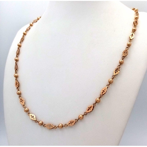 40 - An Antique 15K Yellow Gold (tested) Necklace with Bauble and Cross Shield Links. 64cm. 15.35g