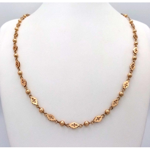 40 - An Antique 15K Yellow Gold (tested) Necklace with Bauble and Cross Shield Links. 64cm. 15.35g