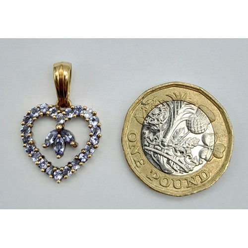 411 - A 9K YELLOW GOLD IOLITE SET OPEN HEART PENDANT -2.4G. 2.5CM. REF: SC4066