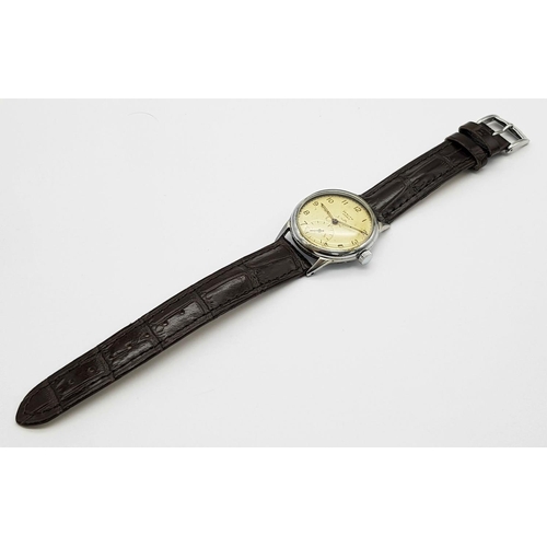 52 - A Vintage 1940/50s Zenith Sports Gents Watch. Brown leather strap. Stainless steel case - 33mm. Pati... 