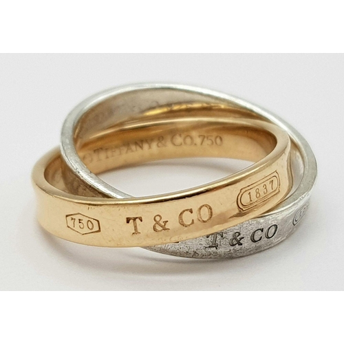 78 - AN 18K YELLOW GOLD & SILVER TIFFANY & CO INTERLOCKING CIRCLES RING - RRP £1600. 6.2G. SIZE K 1/2. RE... 