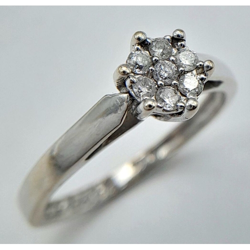 89 - AN 18K WHITE GOLD DIAMOND RING - 0.15CTW. 2.8G. SIZE N. REF: SC4044