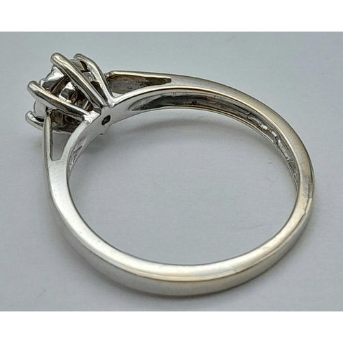 89 - AN 18K WHITE GOLD DIAMOND RING - 0.15CTW. 2.8G. SIZE N. REF: SC4044