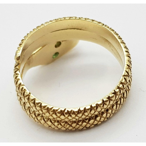 109 - AN 18K YELLOW GOLD SERPENT RING WITH EMERALD SET EYES! 7.5G. SIZE O. REF: SC4048