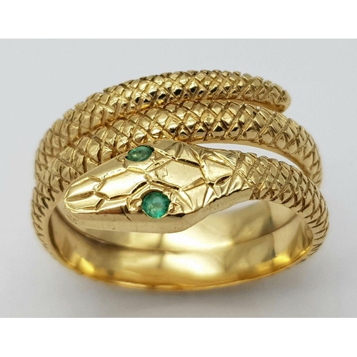 109 - AN 18K YELLOW GOLD SERPENT RING WITH EMERALD SET EYES! 7.5G. SIZE O. REF: SC4048