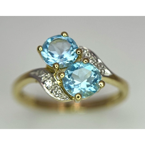 388 - An Excellent Condition Hallmarked 2000 9 Carat Gold Blue Topaz and Diamond Crossover Ring Size K. Se... 