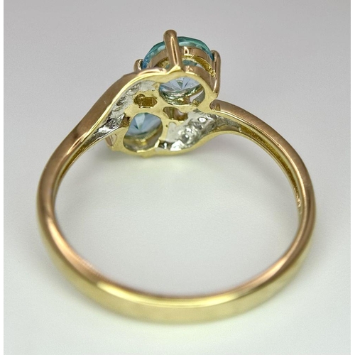 388 - An Excellent Condition Hallmarked 2000 9 Carat Gold Blue Topaz and Diamond Crossover Ring Size K. Se... 