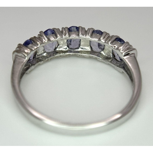 444 - An Excellent Condition Hallmarked 2006, 9 Carat Gold and five stone Tanzanite Ring Size N. Set with ... 