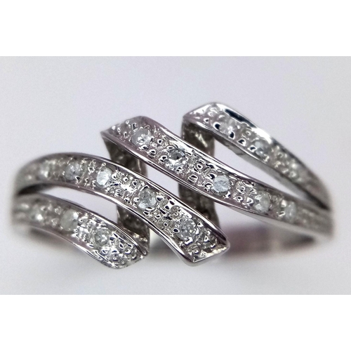 544 - A 9K WHITE GOLD DIAMOND SET 4 ROW SPLIT RING -2.3G. Size Q. REF: 8595