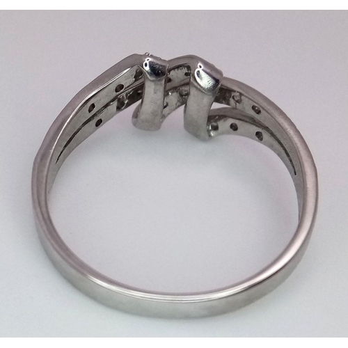 544 - A 9K WHITE GOLD DIAMOND SET 4 ROW SPLIT RING -2.3G. Size Q. REF: 8595