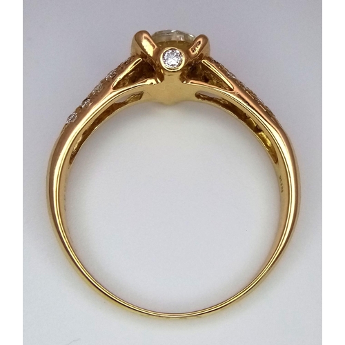 184 - An 18K Yellow Gold and Diamond Gents Dress Ring. A 1.044ct brilliant round cut centre diamond is acc... 