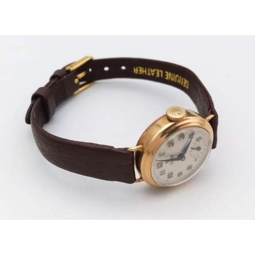 276 - A Vintage 9K Gold Cased Tudor Mechanical Ladies Watch. Brown leather strap. 9k gold case - 21mm. Whi... 