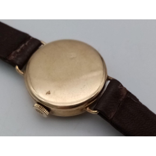 276 - A Vintage 9K Gold Cased Tudor Mechanical Ladies Watch. Brown leather strap. 9k gold case - 21mm. Whi... 