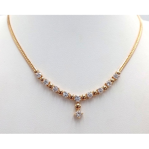 19 - A Gorgeous 18K Yellow Gold Diamond Necklace - Herringbone form leads to 10 brilliant round cut diamo... 