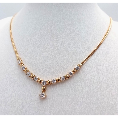 19 - A Gorgeous 18K Yellow Gold Diamond Necklace - Herringbone form leads to 10 brilliant round cut diamo... 