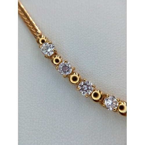 19 - A Gorgeous 18K Yellow Gold Diamond Necklace - Herringbone form leads to 10 brilliant round cut diamo... 