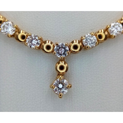 19 - A Gorgeous 18K Yellow Gold Diamond Necklace - Herringbone form leads to 10 brilliant round cut diamo... 