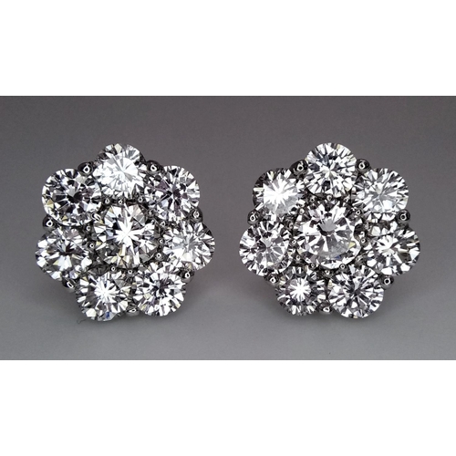 26 - A Stunning Pair of 900 Platinum Diamond Earrings. 5.74ctw of brilliant round cut VS2 diamonds in flo... 