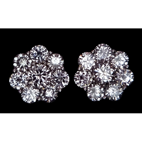 26 - A Stunning Pair of 900 Platinum Diamond Earrings. 5.74ctw of brilliant round cut VS2 diamonds in flo... 