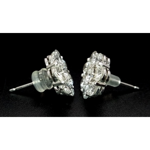 26 - A Stunning Pair of 900 Platinum Diamond Earrings. 5.74ctw of brilliant round cut VS2 diamonds in flo... 