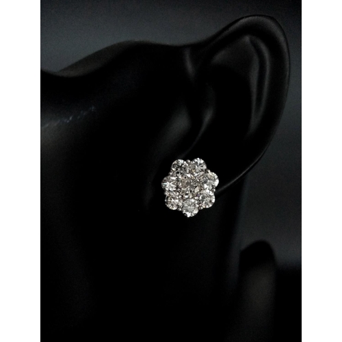 26 - A Stunning Pair of 900 Platinum Diamond Earrings. 5.74ctw of brilliant round cut VS2 diamonds in flo... 