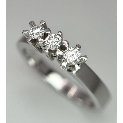 311 - A 18K White Gold Diamond 3 Stone Ring, 3.9g total weight, 0.21ct diamond, size M 1/2.

ref: 158I