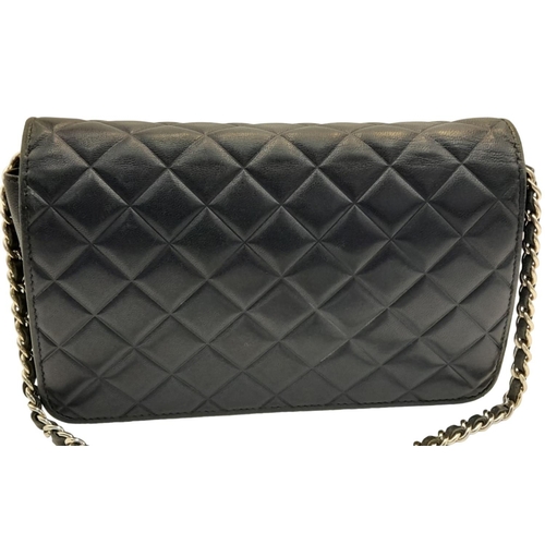 129 - A Chanel Blue Wallet on Chain Crossbody Bag. Quilted leather exterior with silver-toned hardware, ch... 