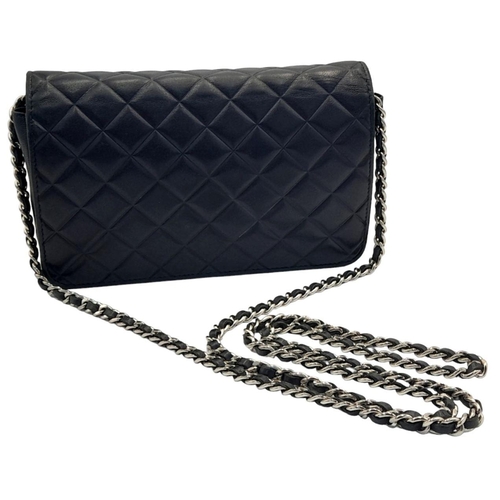 129 - A Chanel Blue Wallet on Chain Crossbody Bag. Quilted leather exterior with silver-toned hardware, ch... 