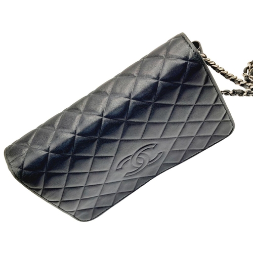 129 - A Chanel Blue Wallet on Chain Crossbody Bag. Quilted leather exterior with silver-toned hardware, ch... 