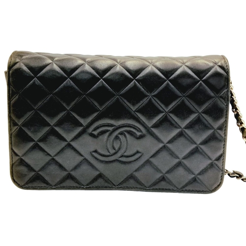 129 - A Chanel Blue Wallet on Chain Crossbody Bag. Quilted leather exterior with silver-toned hardware, ch... 