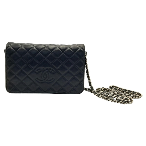 129 - A Chanel Blue Wallet on Chain Crossbody Bag. Quilted leather exterior with silver-toned hardware, ch... 