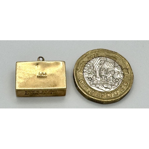 132 - Vintage 9 carat GOLD CHARM. Consisting folded £1 Note in a GOLD CASE.Full UK Hallmark. 2.7 grams.