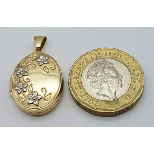 160 - Classic 9 carat GOLD LOCKET.Oval shaped, with contrasting White Gold flower detail to front. Full UK... 