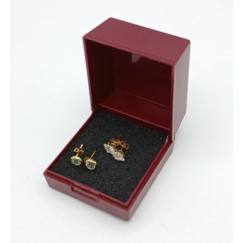 167 - 2 x pairs of 9 CARAT GOLD GEM SET STUD EARRINGS. To include Blue Topaz together with clear Zirconia.... 