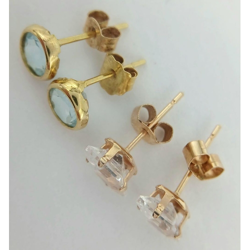 167 - 2 x pairs of 9 CARAT GOLD GEM SET STUD EARRINGS. To include Blue Topaz together with clear Zirconia.... 