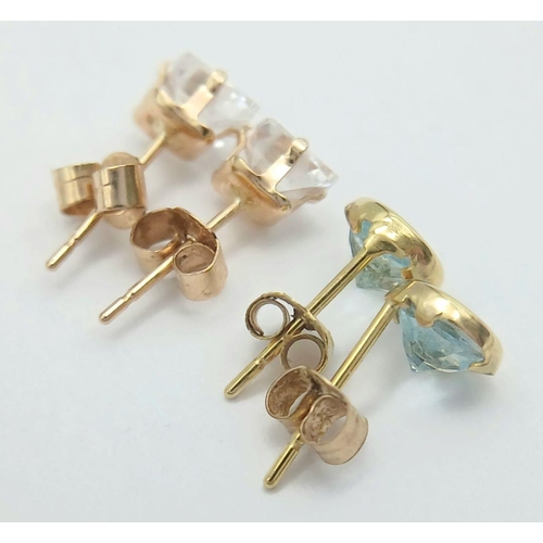 167 - 2 x pairs of 9 CARAT GOLD GEM SET STUD EARRINGS. To include Blue Topaz together with clear Zirconia.... 