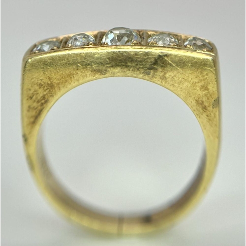 177 - An 18K Yellow Gold Diamond Gents Dress Ring. Five round cut diamonds. Size T 1/2. 15g total weight. ... 