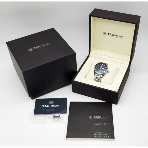 18 - A Tag Heuer Carrera Calibre 5 Automatic Gents Watch. Stainless steel bracelet and case - 41mm. Black... 