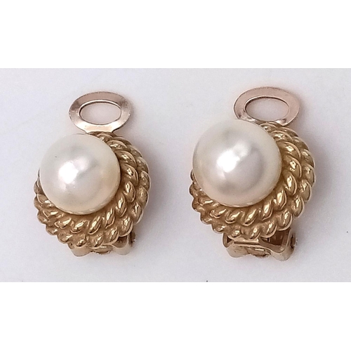 21 - Classic 9 carat GOLD PEARL EARRINGS. Clip on fitting. Having Gold Rope surround. Excellent condition... 