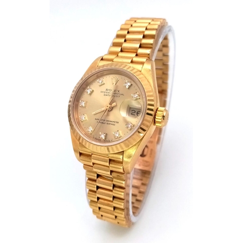 255 - A Classic 18K Gold Rolex Datejust Diamond Ladies Watch. 18k gold bracelet and case - 26mm. Gold tone... 