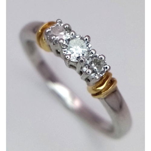 304 - A 18K White Gold Diamond Three Stone Ring, 3.8g total weight, 0.35ct diamond, size N.

ref: 4554H